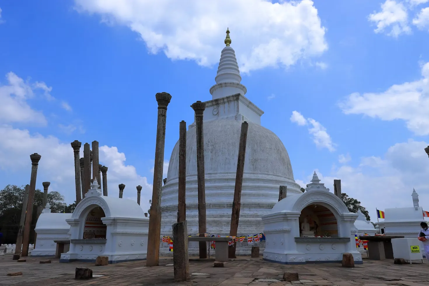 Thuparamaya white stupa surrounded by stone pillars in Anuradhapura