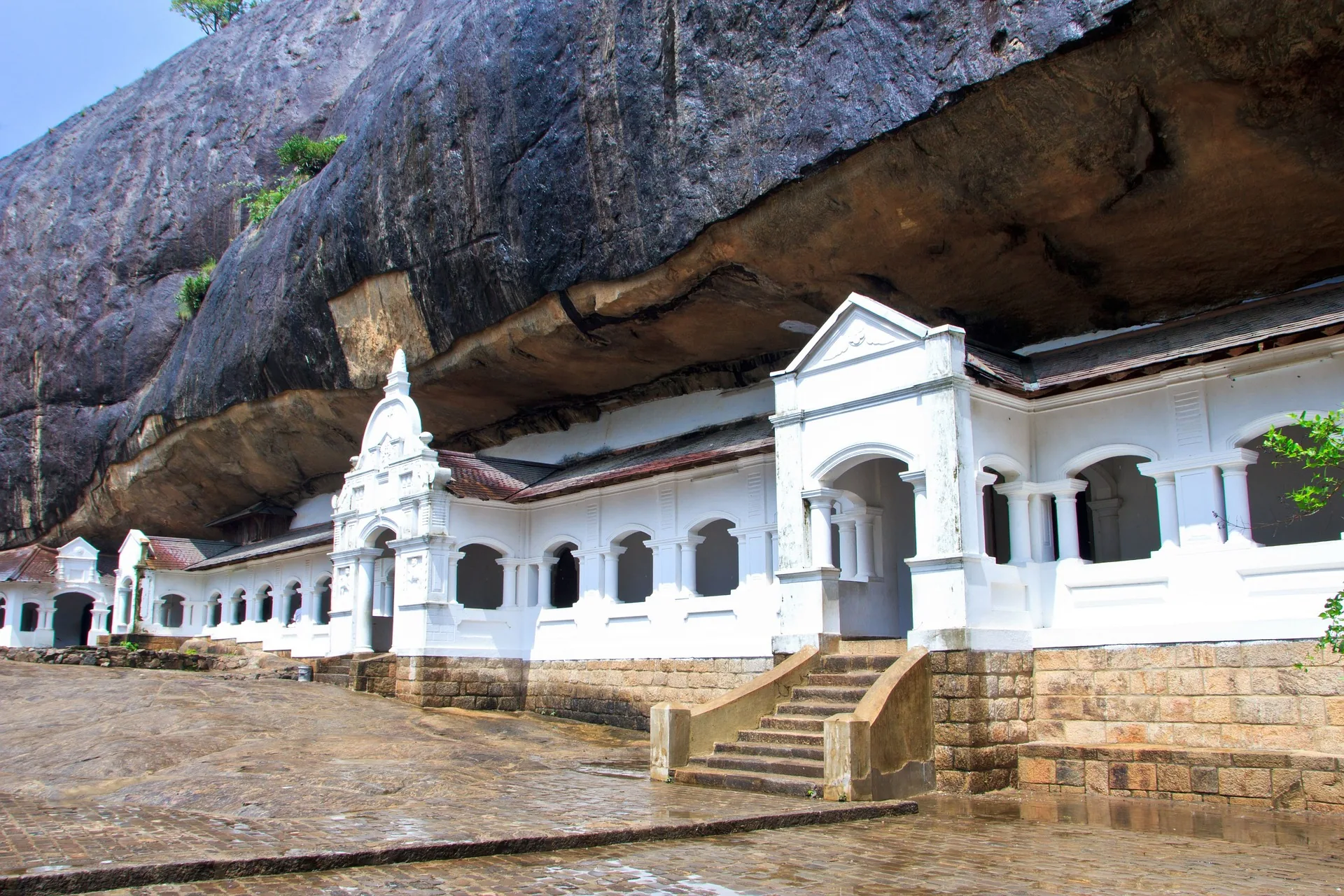 Dambulla Cave Temple beneath its dramatic granite rock overhang