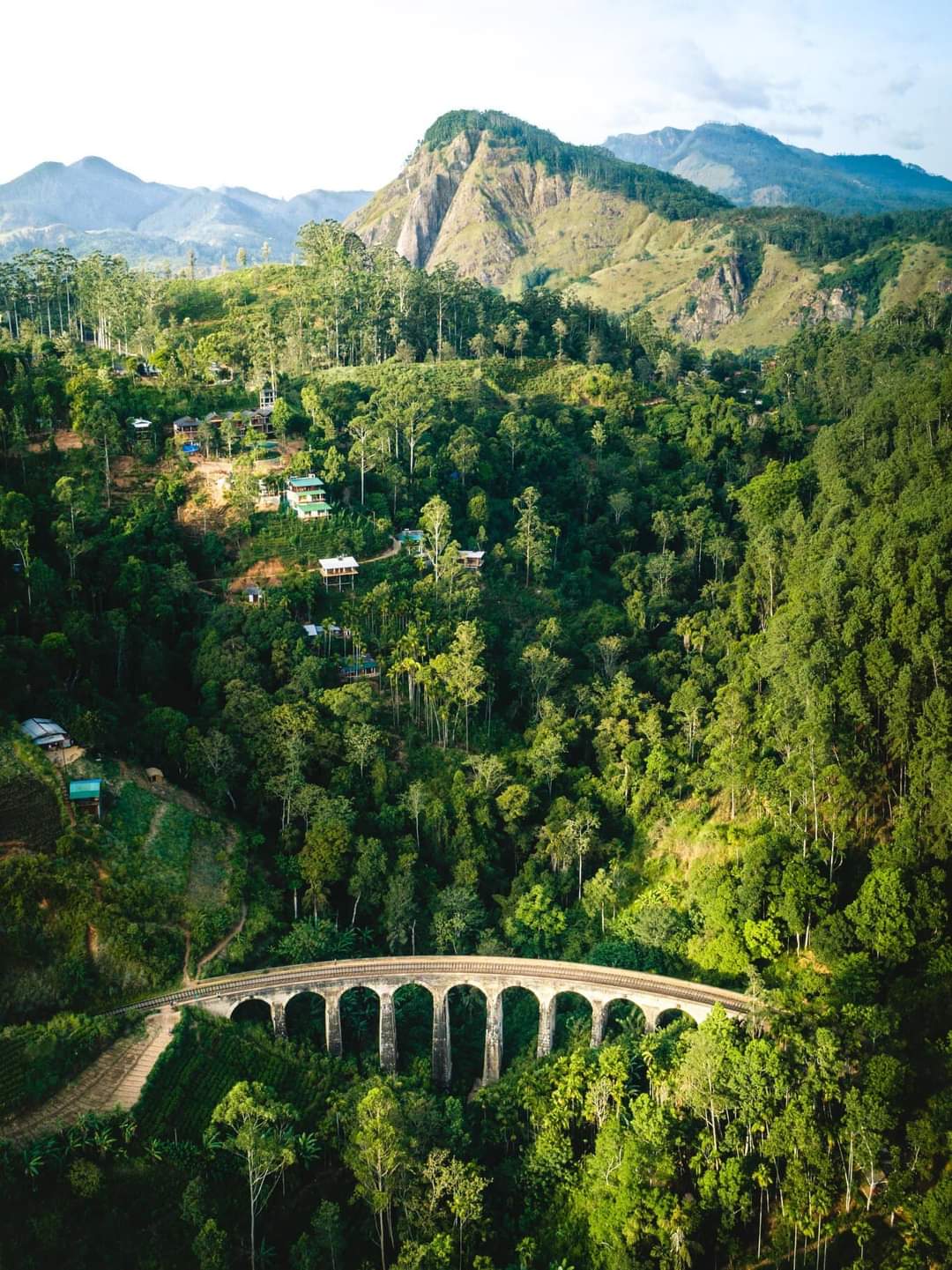 Aerial view of Nine Arch Bridge among Ella's green hill-country landscape