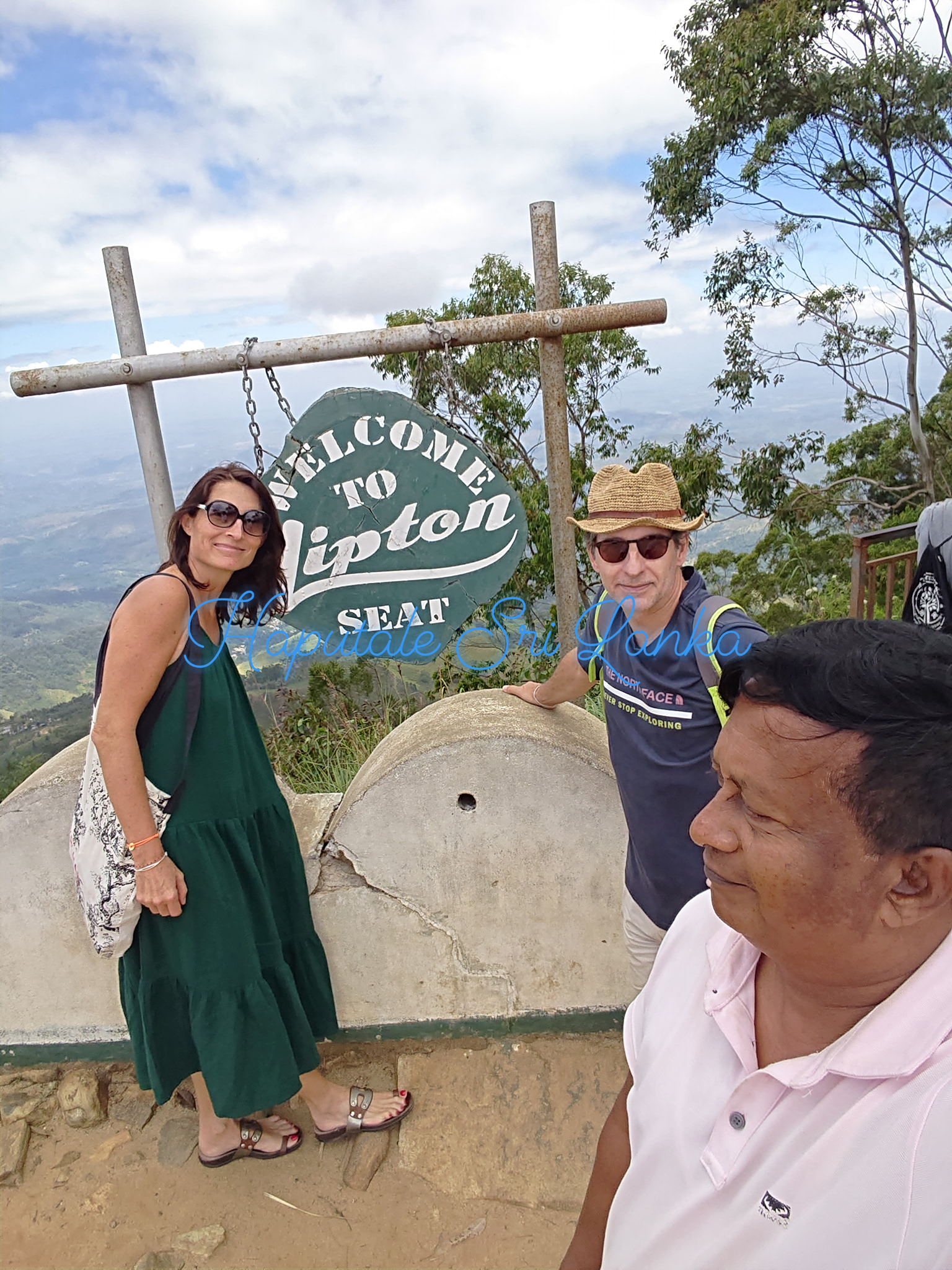 Visitors at the Lipton's Seat welcome sign near Haputale