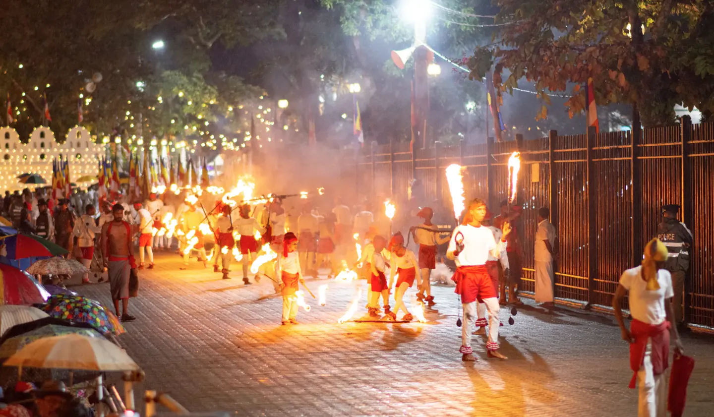 Fire dancers leading the Esala Perahera night procession in Kandy