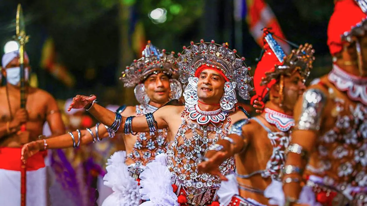 Kandyan dancers in traditional costume at the Esala Perahera festival