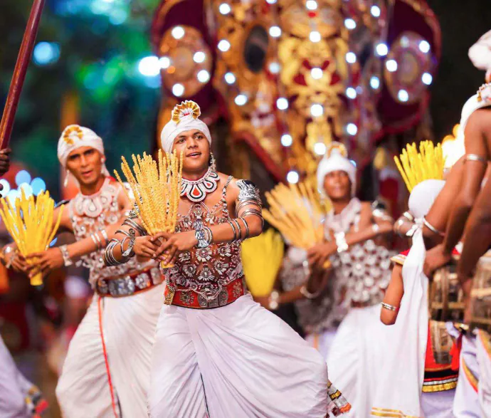Traditional dancers performing during Kandy Esala Perahera