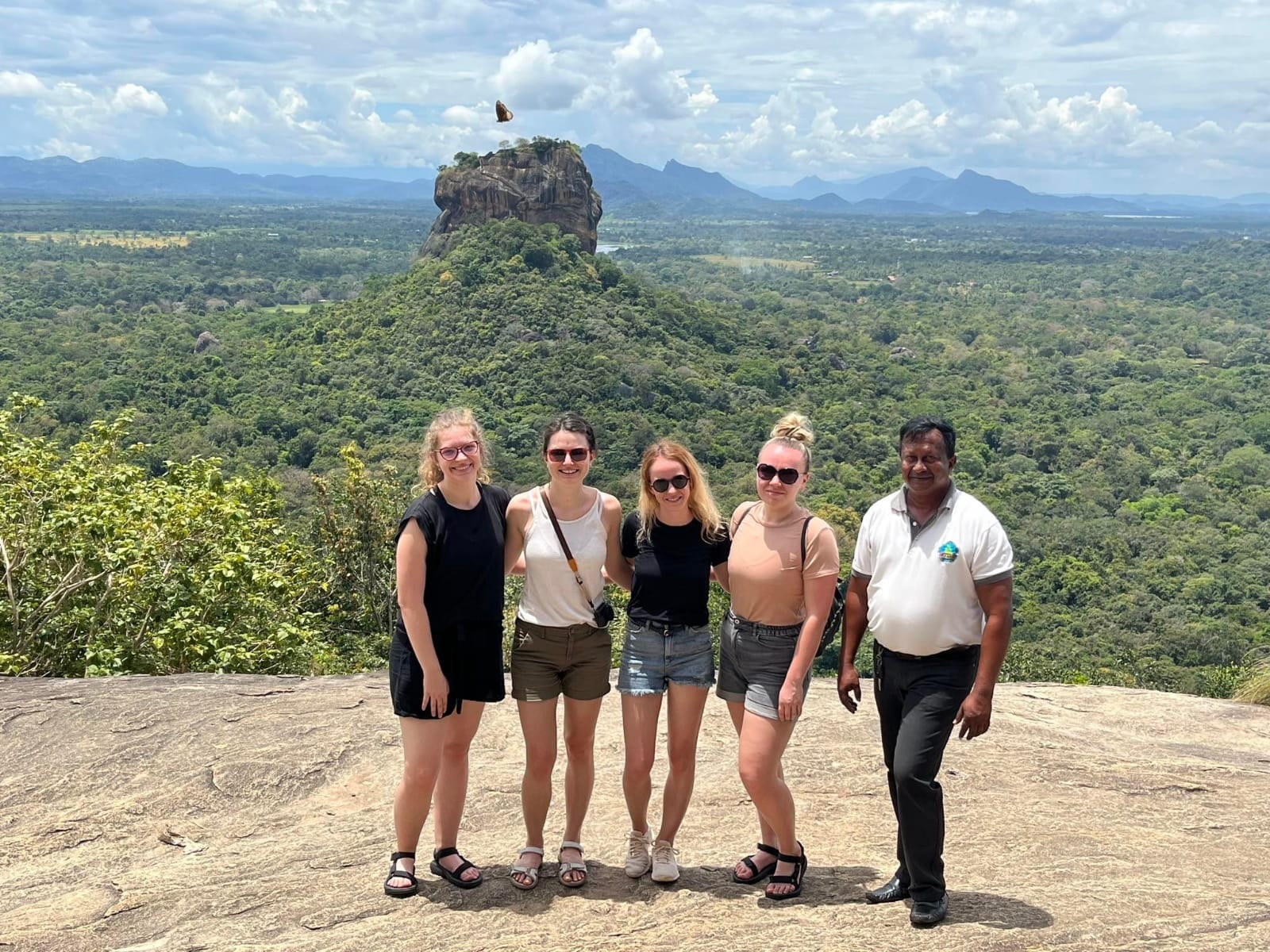 Guests and Emil with a view of Sigiriya from Pidurangala Rock