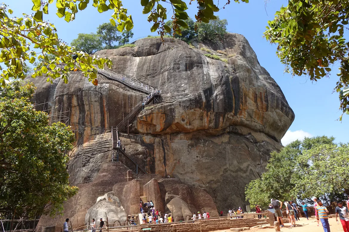 Visitors climbing the Lion Gate staircase at Sigiriya Rock Fortress