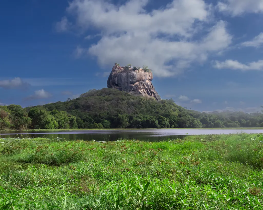Sigiriya Rock reflected beside green countryside