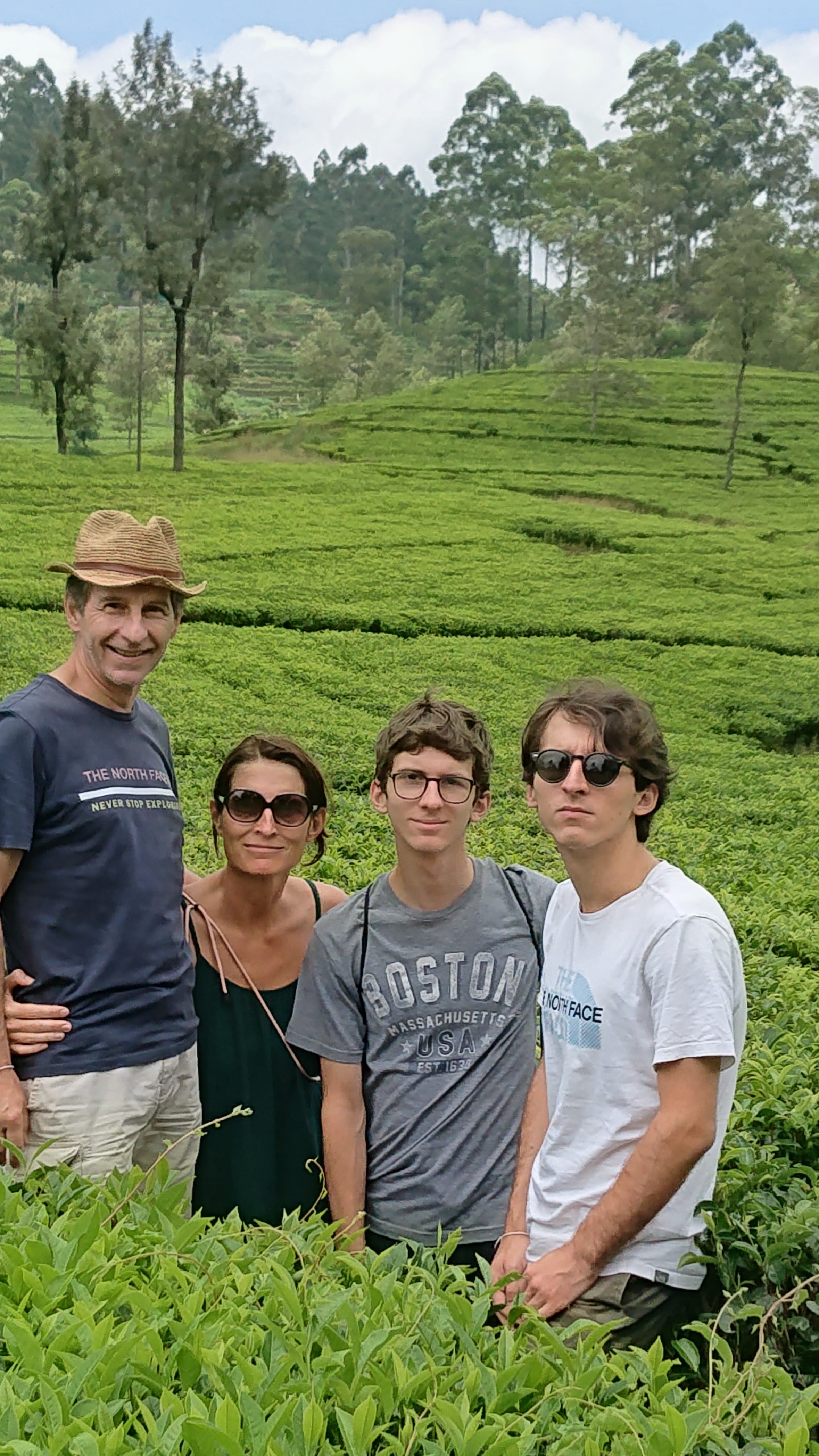 Family in a green tea estate in Sri Lanka